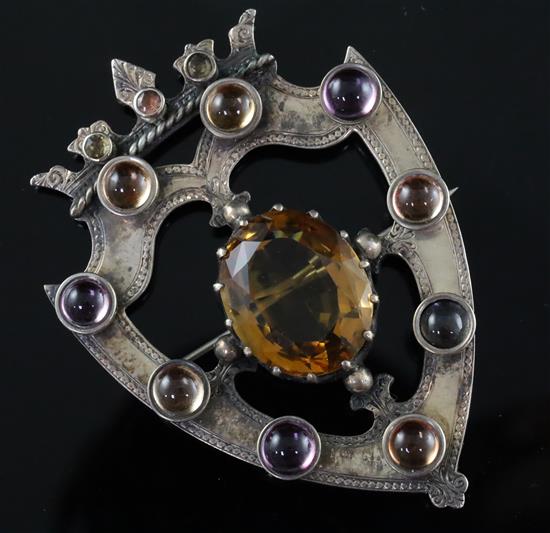 A Victorian Scottish silver, oval cut citrine and cabochon quartz set coronet shield shaped openwork brooch, 65mm.